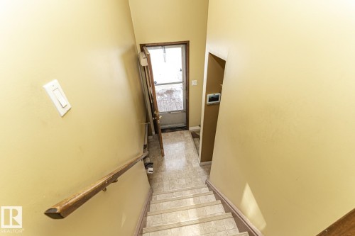 Staircase with baseboards - 10207 165 Avenue, Edmonton, AB - Indoor Photo Showing Other Room
