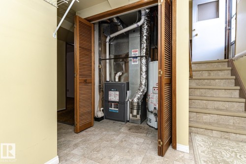 Utility room featuring gas water heater and heating unit - 10207 165 Avenue, Edmonton, AB - Indoor Photo Showing Other Room