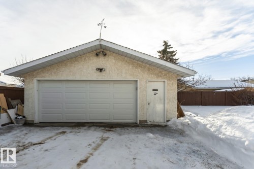 Snow covered garage with a garage - 10207 165 Avenue, Edmonton, AB - Outdoor With Exterior