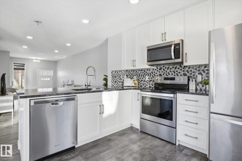 111 3305 Orchards Link, Edmonton, AB - Indoor Photo Showing Kitchen With Stainless Steel Kitchen With Upgraded Kitchen