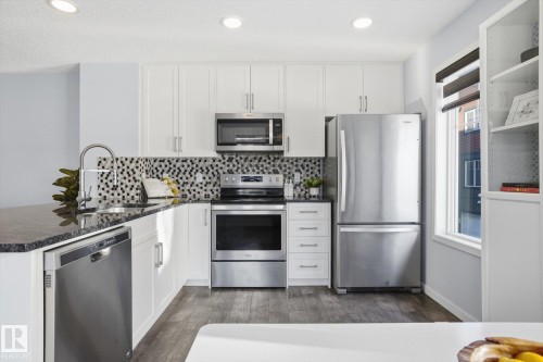 111 3305 Orchards Link, Edmonton, AB - Indoor Photo Showing Kitchen With Stainless Steel Kitchen With Upgraded Kitchen