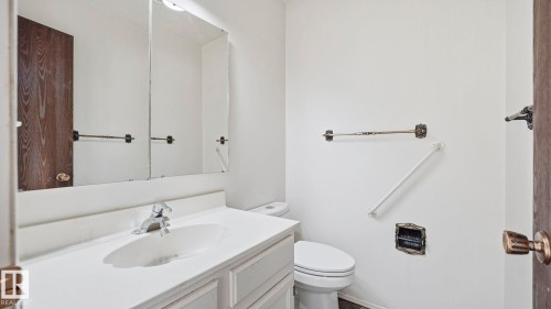 Half bath featuring vanity and toilet - 10478 21 Avenue, Edmonton, AB - Indoor Photo Showing Bathroom