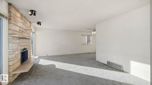 10478 21 Avenue, Edmonton, AB - Indoor Photo Showing Other Room With Fireplace