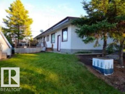 View of property exterior with a lawn - 4910 53 Avenue, Willingdon, AB 