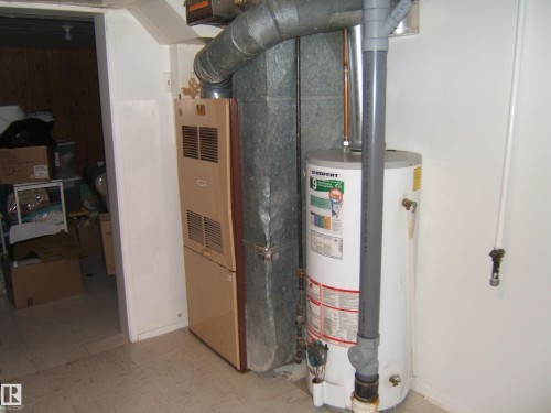 Utility room featuring water heater - 4910 53 Avenue, Willingdon, AB 