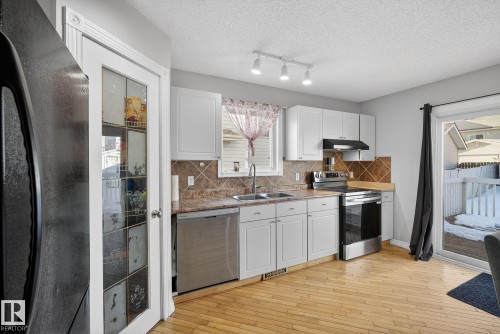 14816 47 Street, Edmonton, AB - Indoor Photo Showing Kitchen With Double Sink
