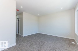 Unfurnished room with light colored carpet and recessed lighting - 