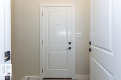 Doorway featuring baseboards - 
