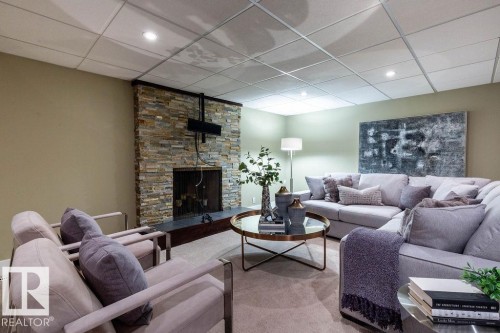 104 Quesnell Crescent, Edmonton, AB - Indoor Photo Showing Living Room With Fireplace