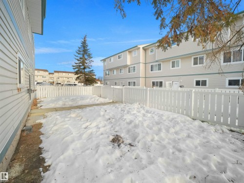 Yard layered in snow featuring a fenced backyard - 1460 Lakewood Road W, Edmonton, AB - Outdoor