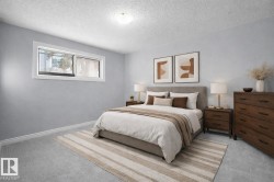 Virtually stagec - Second bedroom featuring carpet floors and a textured ceiling - 