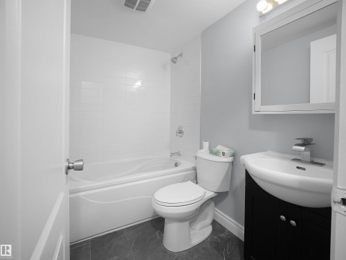 Full bath with vanity and shower / bathtub combination - 1460 Lakewood Road W, Edmonton, AB - Indoor Photo Showing Bathroom