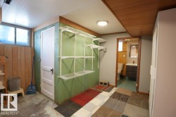 Full bathroom with vanity, concrete floors, wooden walls, and wood ceiling - 