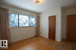 Unfurnished bedroom featuring light wood-style flooring and a closet - 