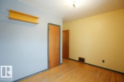 Empty room with light wood-style floors and baseboards - 