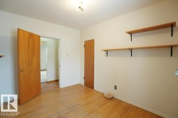 Unfurnished room featuring light wood finished floors and baseboards - 