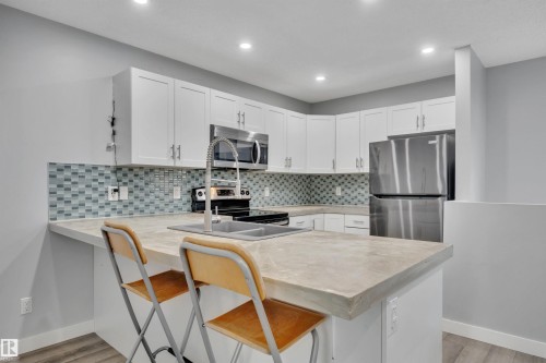 1558 Plum Circle Sw, Edmonton, AB - Indoor Photo Showing Kitchen With Double Sink