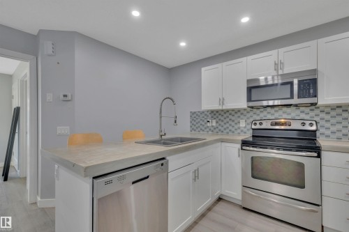 1558 Plum Circle Sw, Edmonton, AB - Indoor Photo Showing Kitchen With Double Sink
