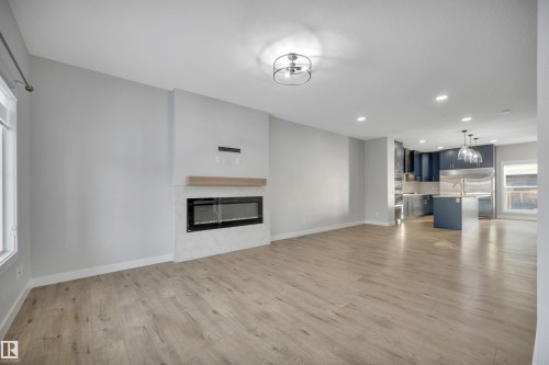 1558 Plum Circle Sw, Edmonton, AB - Indoor Photo Showing Living Room With Fireplace