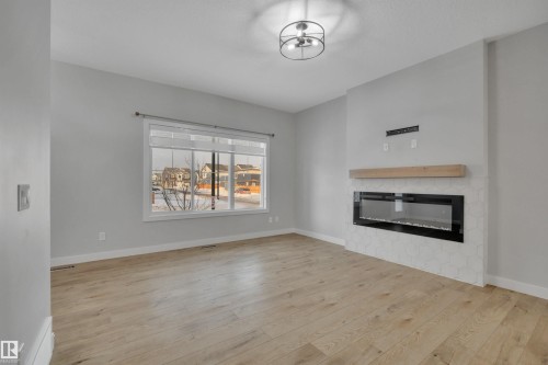 1558 Plum Circle Sw, Edmonton, AB - Indoor Photo Showing Living Room With Fireplace