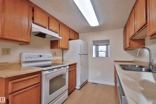 51 10453 20 Avenue, Edmonton, AB - Indoor Photo Showing Kitchen With Double Sink