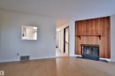 51 10453 20 Avenue, Edmonton, AB  - Indoor Photo Showing Living Room With Fireplace 