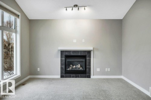 708 60 Street, Edmonton, AB - Indoor Photo Showing Living Room With Fireplace