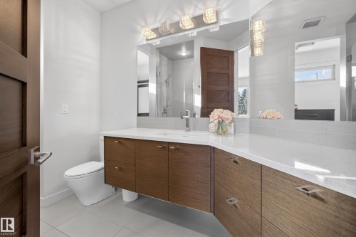 Bathroom with vanity, a shower stall, and light tile patterned floors - 9415 144 Street, Edmonton, AB - Indoor Photo Showing Bathroom
