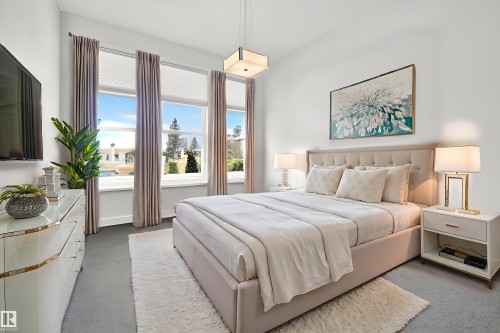 Carpeted bedroom featuring baseboards - 9415 144 Street, Edmonton, AB - Indoor Photo Showing Bedroom