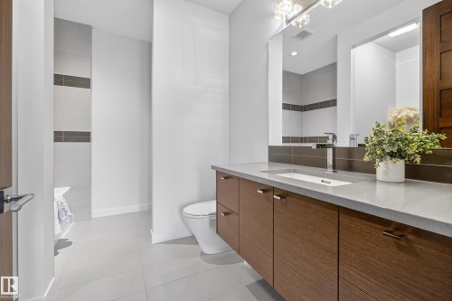 Bathroom featuring vanity and light tile patterned floors - 9415 144 Street, Edmonton, AB - Indoor Photo Showing Bathroom