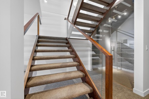Stairway with carpet and baseboards - 9415 144 Street, Edmonton, AB - Indoor Photo Showing Other Room