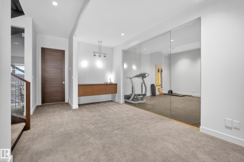 Exercise room featuring carpet floors and recessed lighting - 9415 144 Street, Edmonton, AB - Indoor