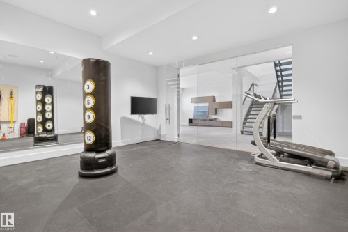 Exercise room with rubber floors and recessed lighting - 9415 144 Street, Edmonton, AB - Indoor Photo Showing Gym Room