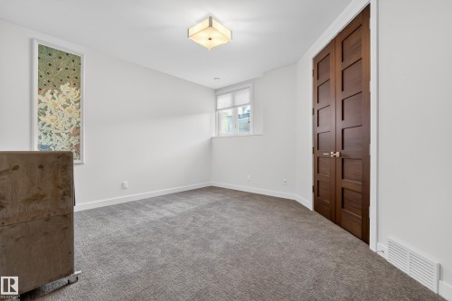 Unfurnished bedroom with carpet floors and a closet - 9415 144 Street, Edmonton, AB - Indoor Photo Showing Other Room