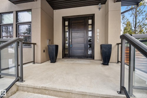 View of exterior entry featuring stucco siding and covered porch - 9415 144 Street, Edmonton, AB - Outdoor With Exterior