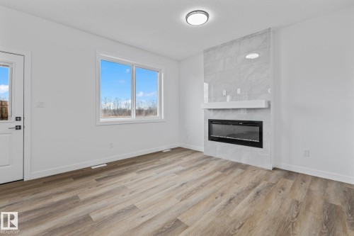 68 Waverly Way, Fort Saskatchewan, AB - Indoor Photo Showing Living Room With Fireplace
