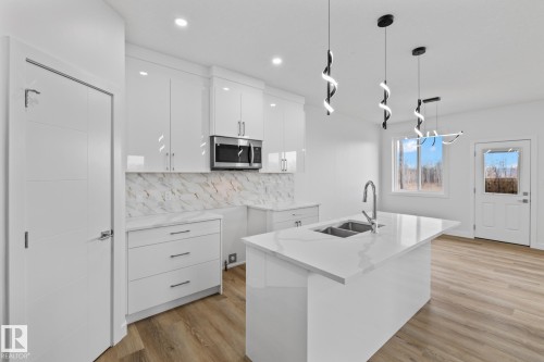 68 Waverly Way, Fort Saskatchewan, AB - Indoor Photo Showing Kitchen With Double Sink With Upgraded Kitchen