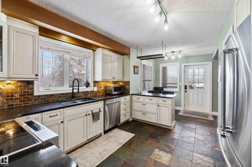 501 Lakeside Drive, Rural Parkland County, AB - Indoor Photo Showing Kitchen With Double Sink
