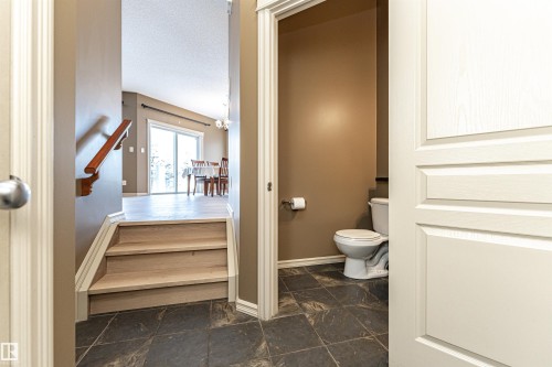 Bathroom featuring stone tile floors and a textured ceiling - 1612 Lacombe Crest, Edmonton, AB - Indoor