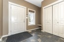 Foyer entrance featuring stone tile floors and a textured ceiling - 1612 Lacombe Crest, Edmonton, AB  - Indoor Photo Showing Other Room 