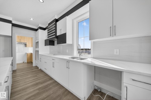 464 Crystal Creek Link, Leduc, AB - Indoor Photo Showing Kitchen With Double Sink