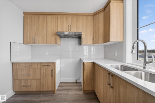 464 Crystal Creek Link, Leduc, AB - Indoor Photo Showing Kitchen With Double Sink
