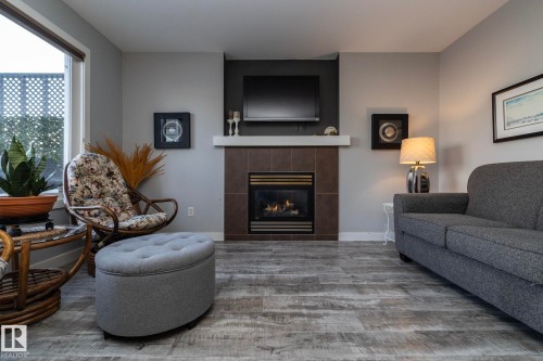 1615 Rutherford Road, Edmonton, AB - Indoor Photo Showing Living Room With Fireplace