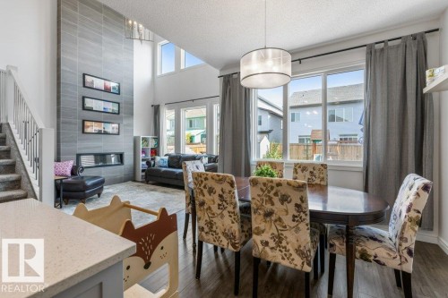9639 224 Street, Edmonton, AB - Indoor Photo Showing Dining Room With Fireplace