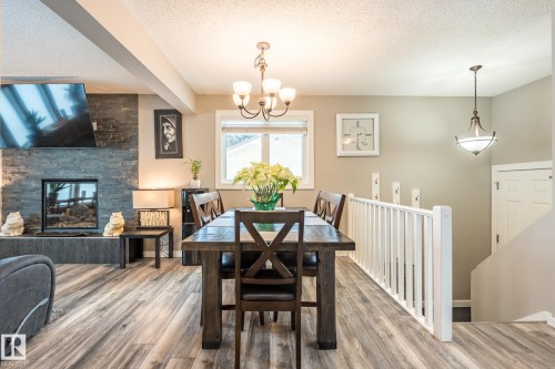 139 Willow Drive, Wetaskiwin, AB - Indoor Photo Showing Dining Room With Fireplace