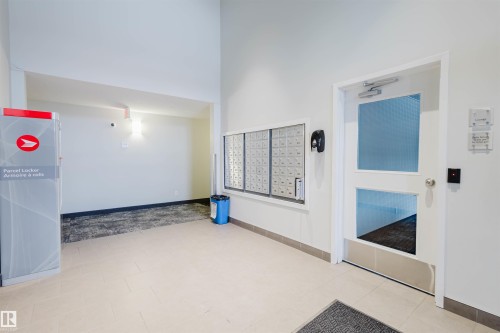Community lobby with a high ceiling - 108 396 Silver Berry Road, Edmonton, AB - Indoor Photo Showing Other Room