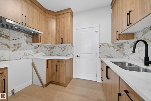 461 Crystal Creek Link, Leduc, AB - Indoor Photo Showing Kitchen With Double Sink