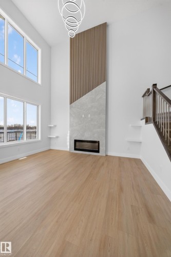 461 Crystal Creek Link, Leduc, AB - Indoor Photo Showing Other Room With Fireplace