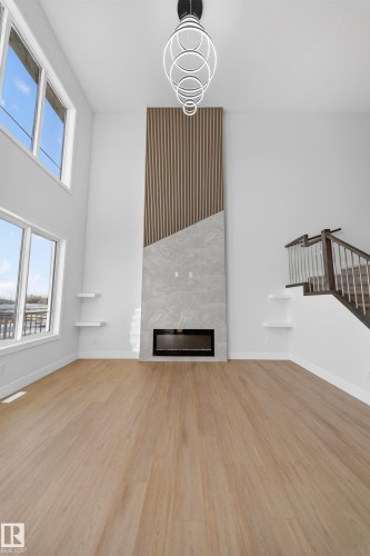 461 Crystal Creek Link, Leduc, AB - Indoor Photo Showing Other Room With Fireplace