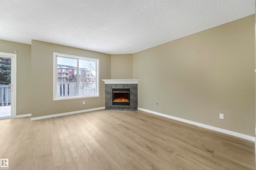 33 4020 21 Street, Edmonton, AB - Indoor Photo Showing Living Room With Fireplace